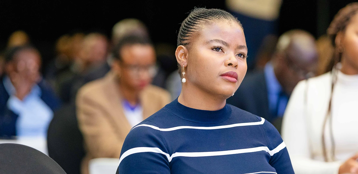 Charity Moyo at conference